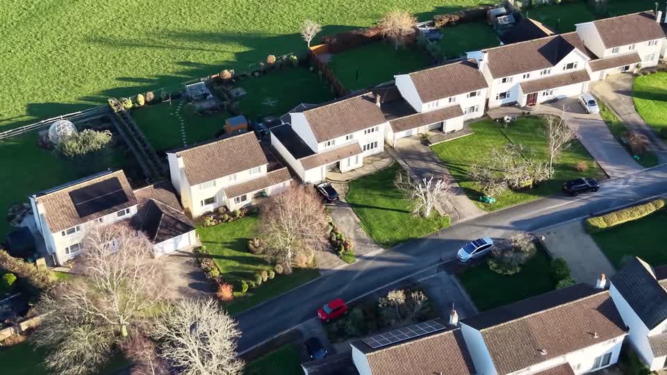 Aerial view moving over residential houses as you scroll